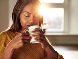 A woman enjoying her coffee